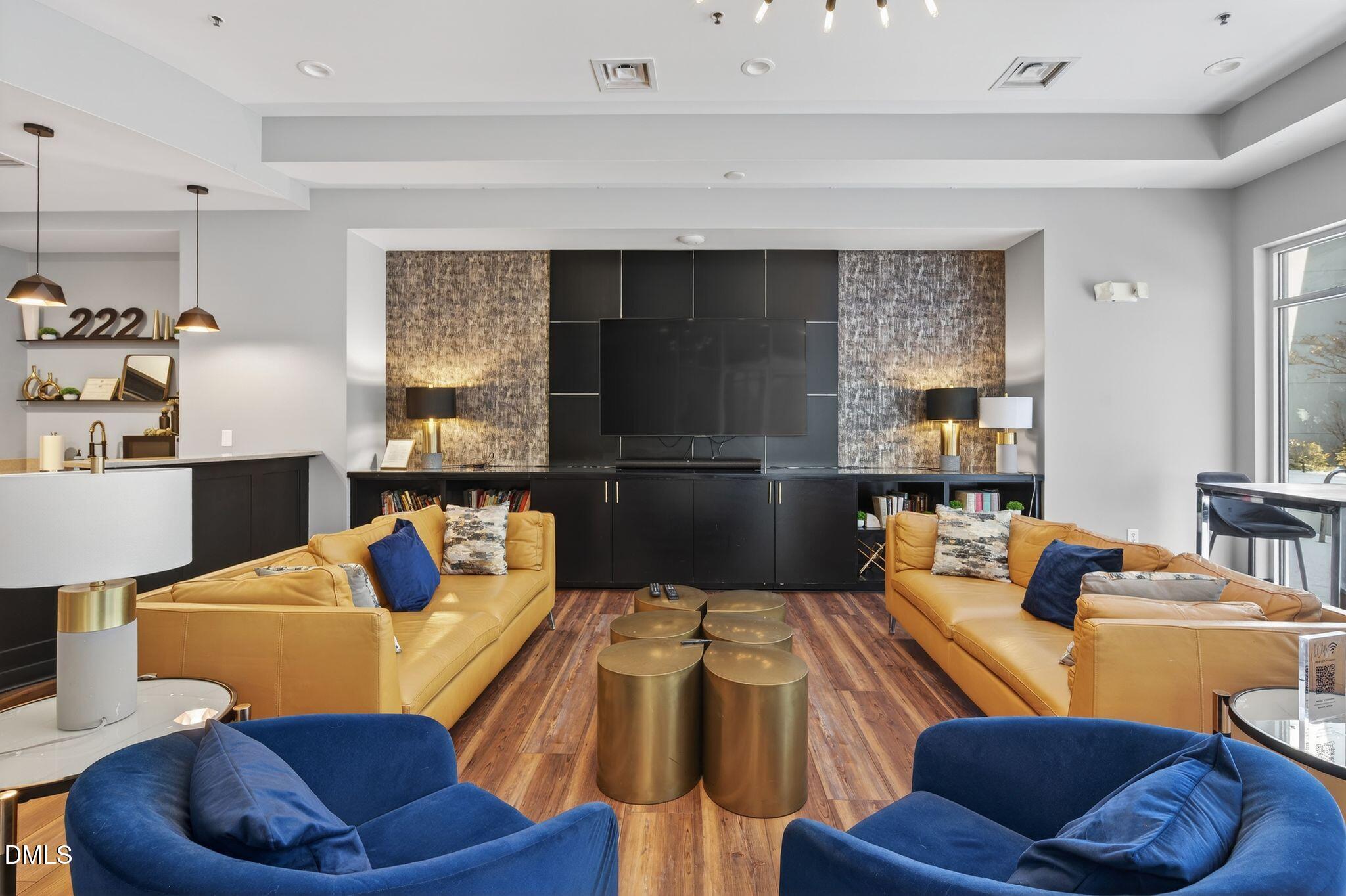 222 Glenwood Avenue, Unit 605 Raleigh, NC 27603 - Photo 57 of 60 a living room with furniture kitchen view and a window