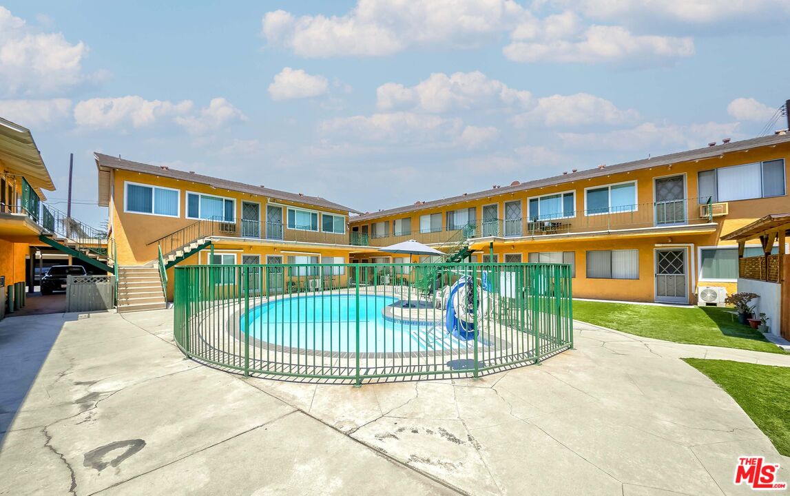 a view of a house with a yard and plants