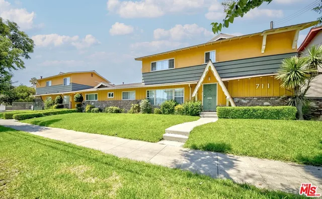 a view of house with garden and pathway