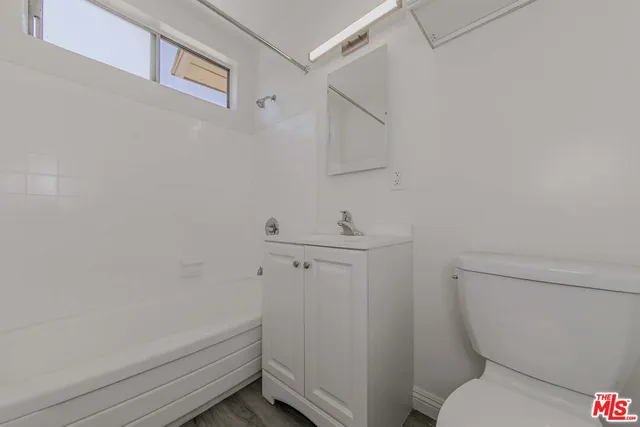 a bathroom with a toilet and a sink