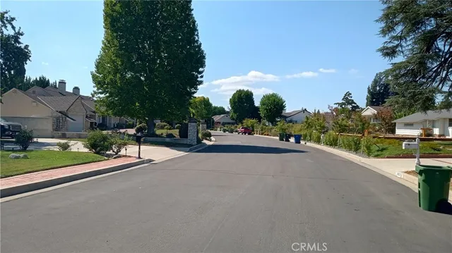 a view of a street with a houses
