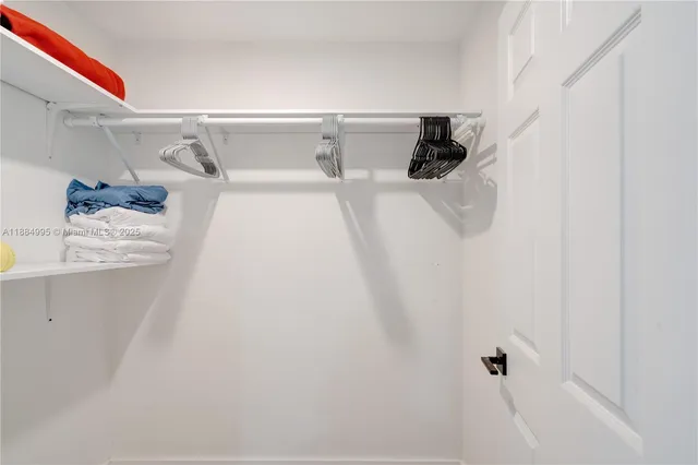 a kitchen with stainless steel appliances a sink a stove and refrigerator