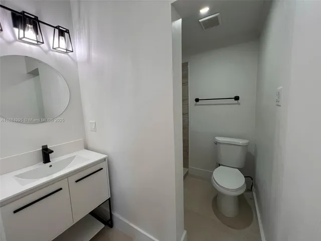 a view of a hallway with washer and dryer