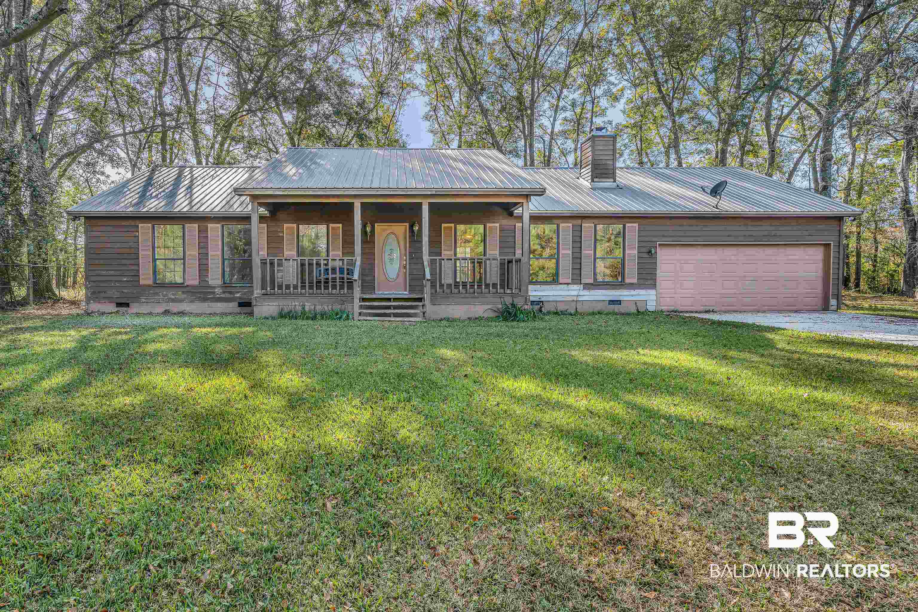 7787 Bellingrath Road Theodore, AL 36582 - Photo 5 of 36 View of front facade with crawl space, a porch, and a front lawn