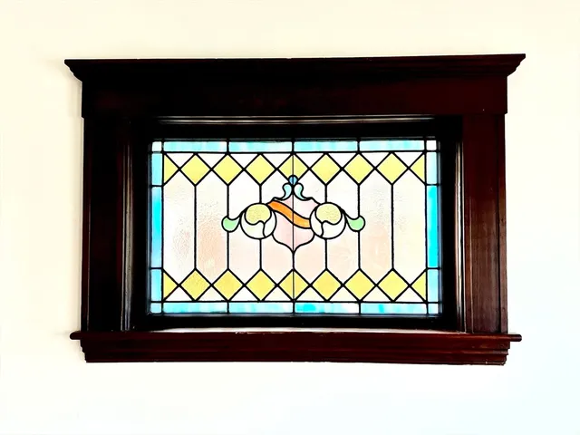 a living room with furniture sinks and a large window