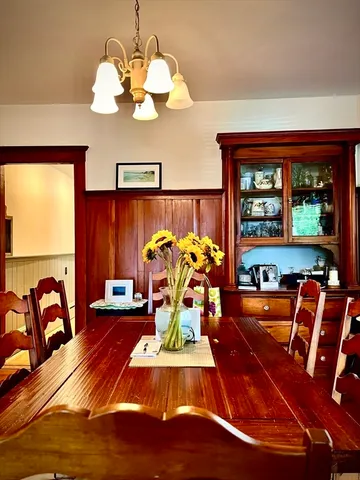 a room with a bed and a chandelier