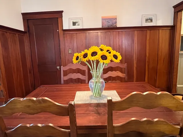 a view of a porch with furniture and garden