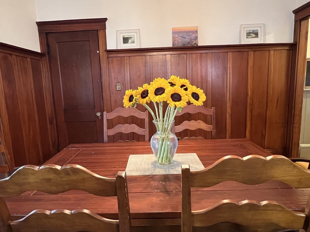 67 Commonwealth Road, Unit 2 Watertown, MA 02472 - Photo 6 of 12 a room with a bed and a chandelier