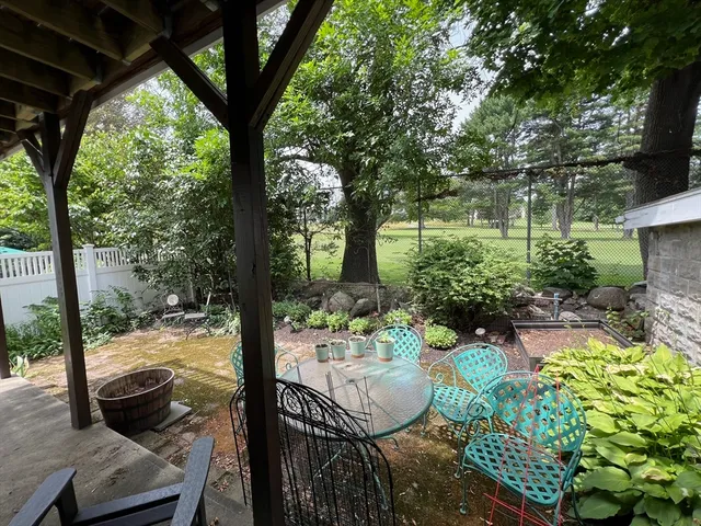 a view of backyard with seating space