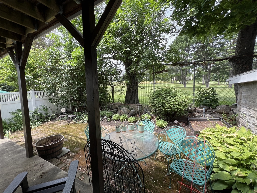 67 Commonwealth Road, Unit 2 Watertown, MA 02472 - Photo 7 of 12 a view of a porch with furniture and garden