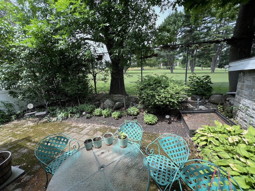 67 Commonwealth Road, Unit 2 Watertown, MA 02472 - Photo 8 of 12 a view of backyard with seating space