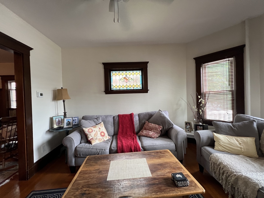 67 Commonwealth Road, Unit 2 Watertown, MA 02472 - Photo 9 of 12 a living room with furniture and a window