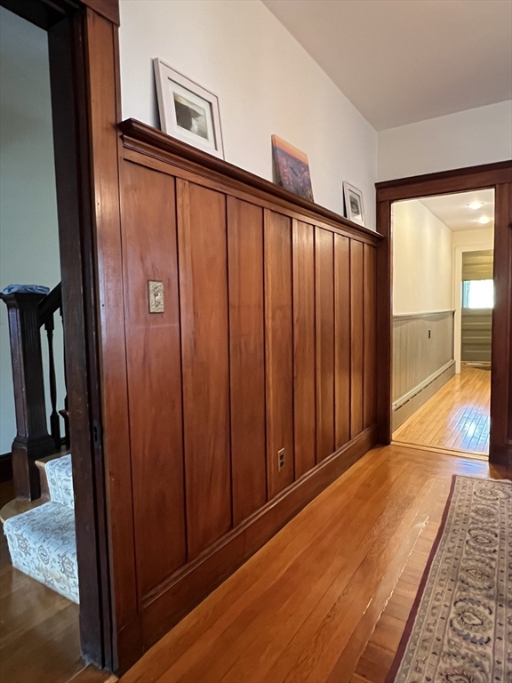67 Commonwealth Road, Unit 2 Watertown, MA 02472 - Photo 10 of 12 a view of a porch with wooden floor and stairs