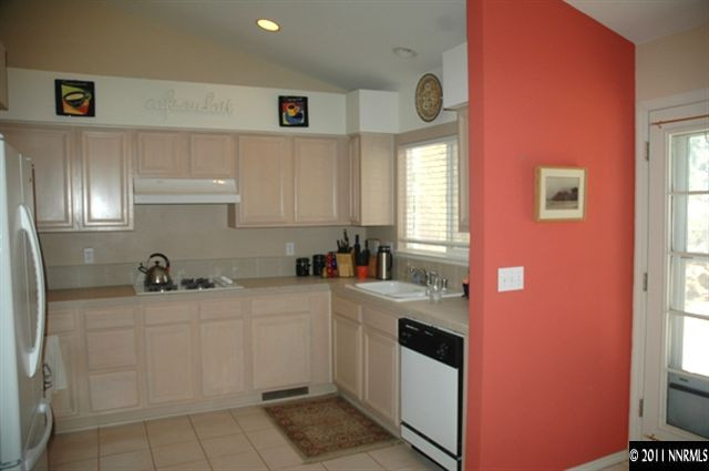 2789 Montego Drive Reno, NV 89523 - Photo 4 of 11 a kitchen with a sink a stove and cabinets