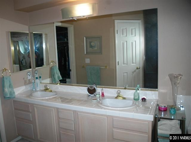 2789 Montego Drive Reno, NV 89523 - Photo 6 of 11 a bathroom with a sink and a mirror
