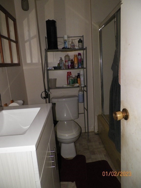 37 Prospect Street Webster, MA 01570 - Photo 12 of 20 a bathroom with a toilet and a shower