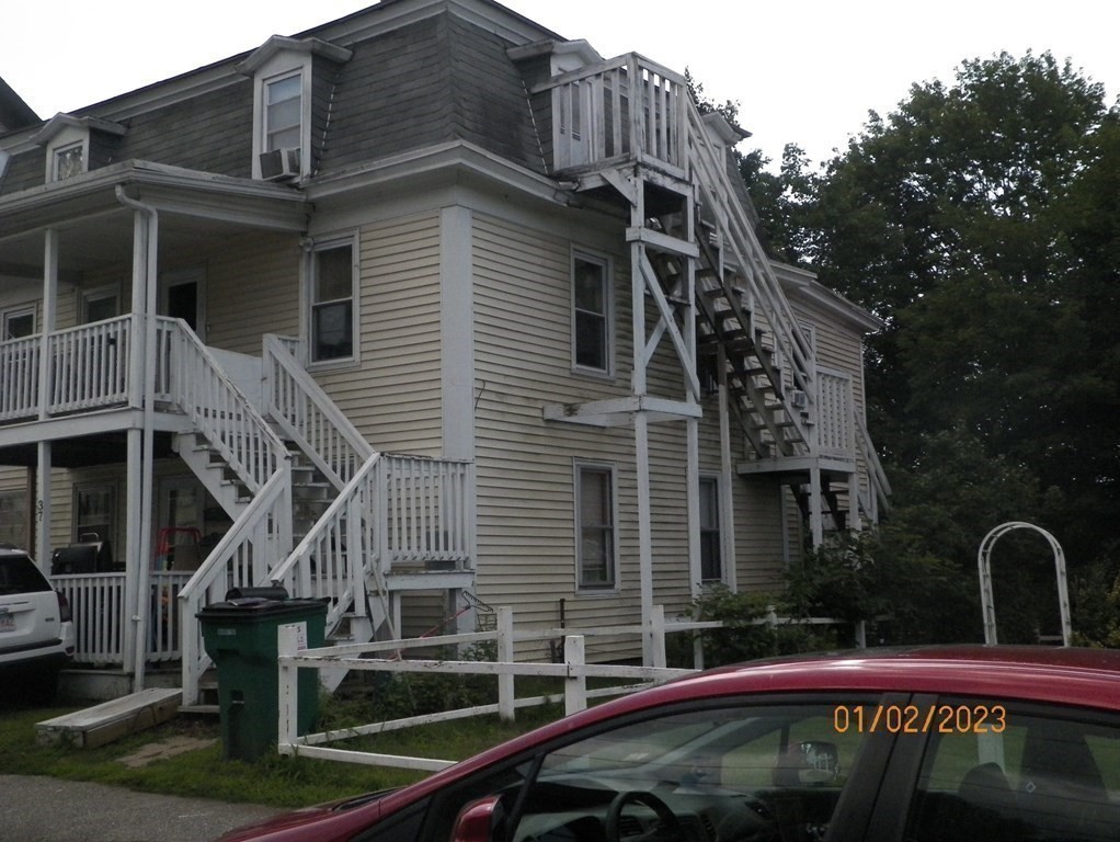 37 Prospect Street Webster, MA 01570 - Photo 18 of 20 a front view of a house with parking space