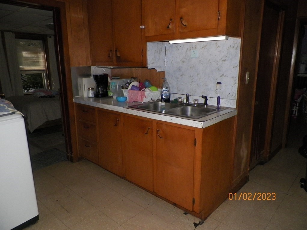 37 Prospect Street Webster, MA 01570 - Photo 3 of 20 a kitchen with stainless steel appliances granite countertop a sink stove and cabinets