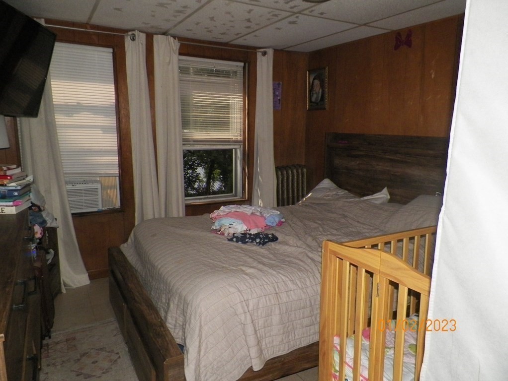 37 Prospect Street Webster, MA 01570 - Photo 4 of 20 a bedroom with bed and a window