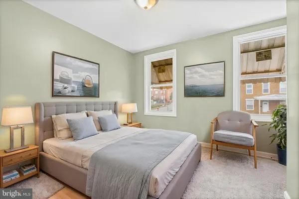 a bedroom with a bed and a couch