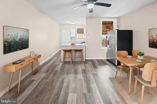 a workspace with furniture a rug and wooden floor