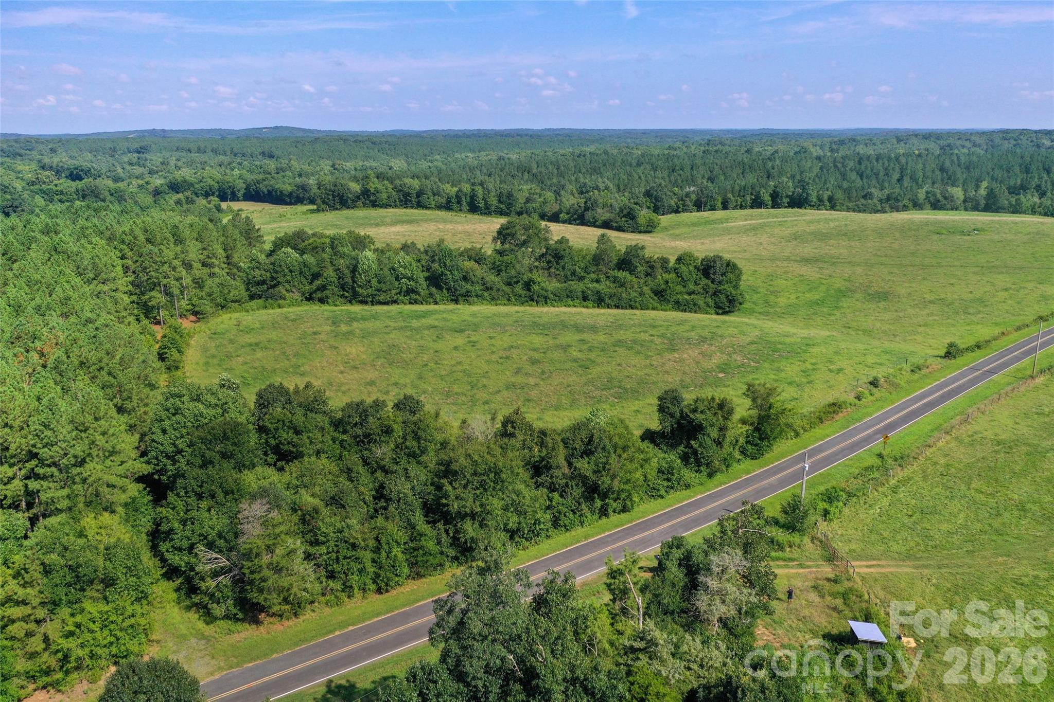 0 Lucy Short Cut Road, Unit A Marshville, NC 28103 - Photo 13 of 23 a view of a green field with a house in the background