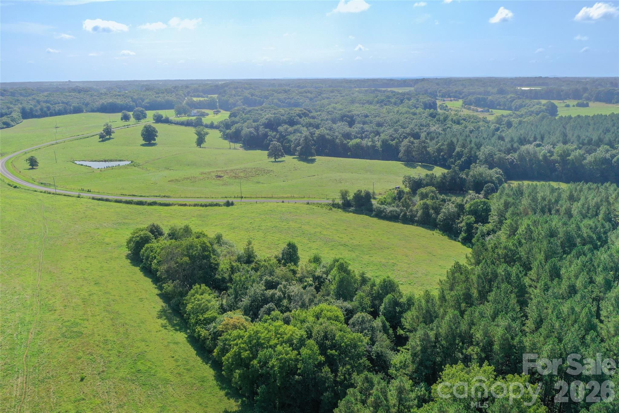 0 Lucy Short Cut Road, Unit A Marshville, NC 28103 - Photo 10 of 23 a view of a swimming pool with a yard and lake view