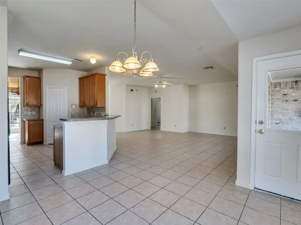 a view of a kitchen with a sink and cabinets