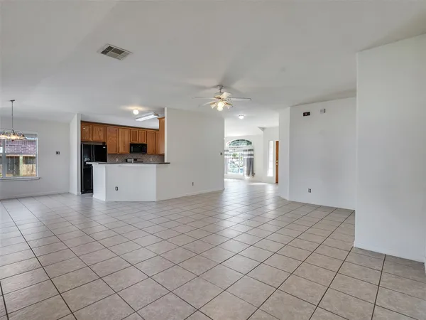 a view of a kitchen with a sink and a stove top oven