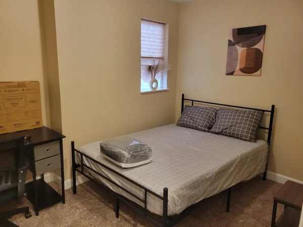 a bedroom with a bed and cabinets