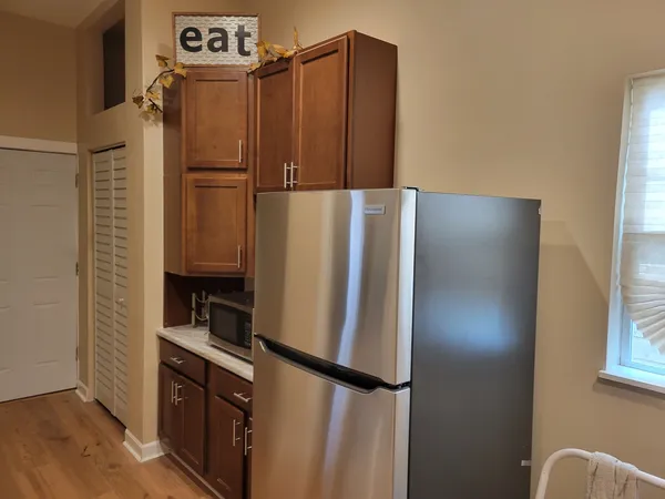 a room with a sink a chair and stairs