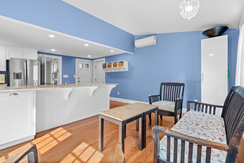 210 Plympton Road Sudbury, MA 01776 - Photo 6 of 40 a living room with furniture and a table