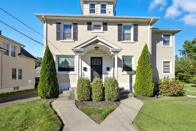 front view of a house with a yard