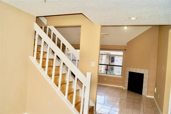 a view of an entryway with wooden floor and door