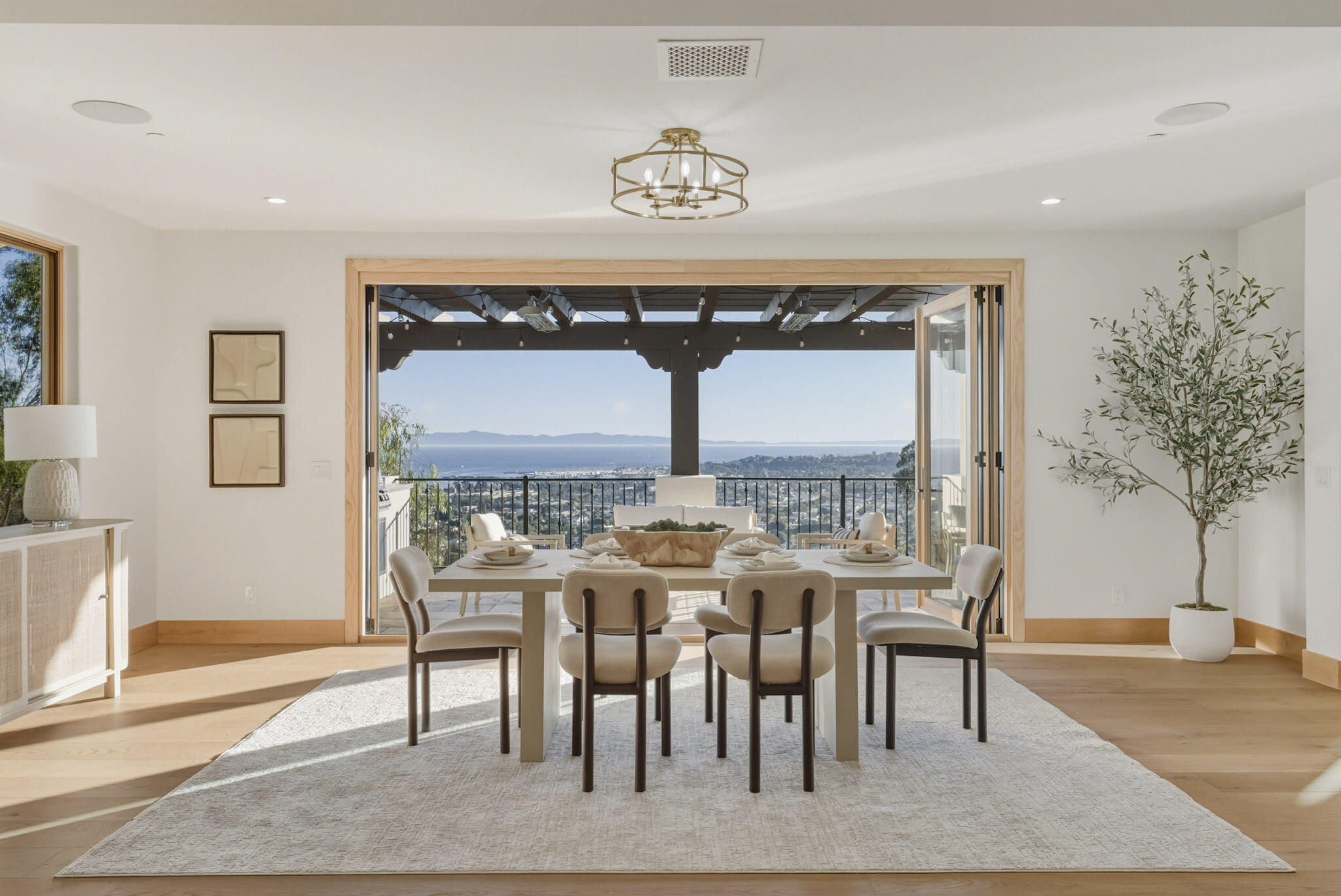 210 Las Alturas Road Santa Barbara, CA 93103 - Photo 13 of 61 a view of a dining room with furniture and chandelier