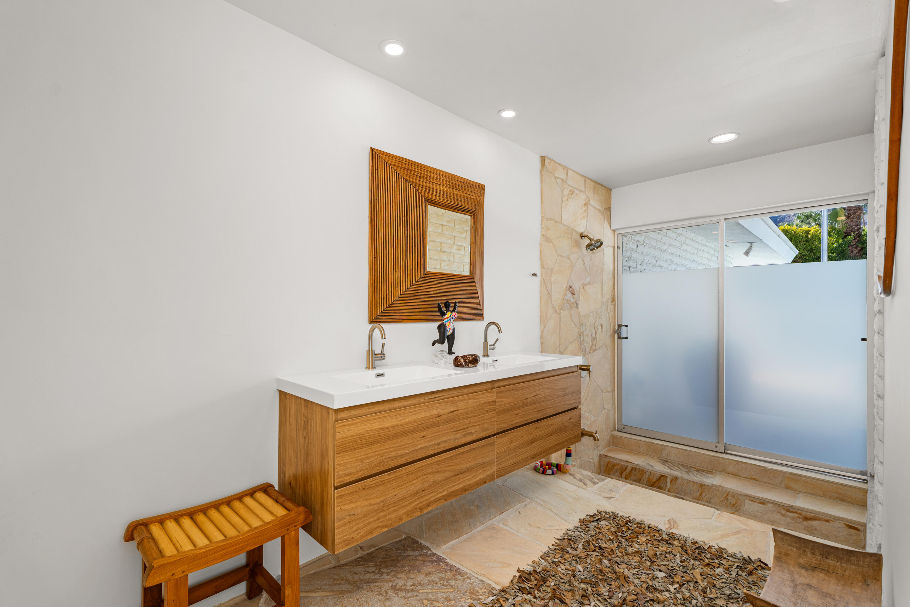 40286 Tonopah Road Rancho Mirage, CA 92270 - Photo 21 of 49 a bathroom with a sink mirror and a shower