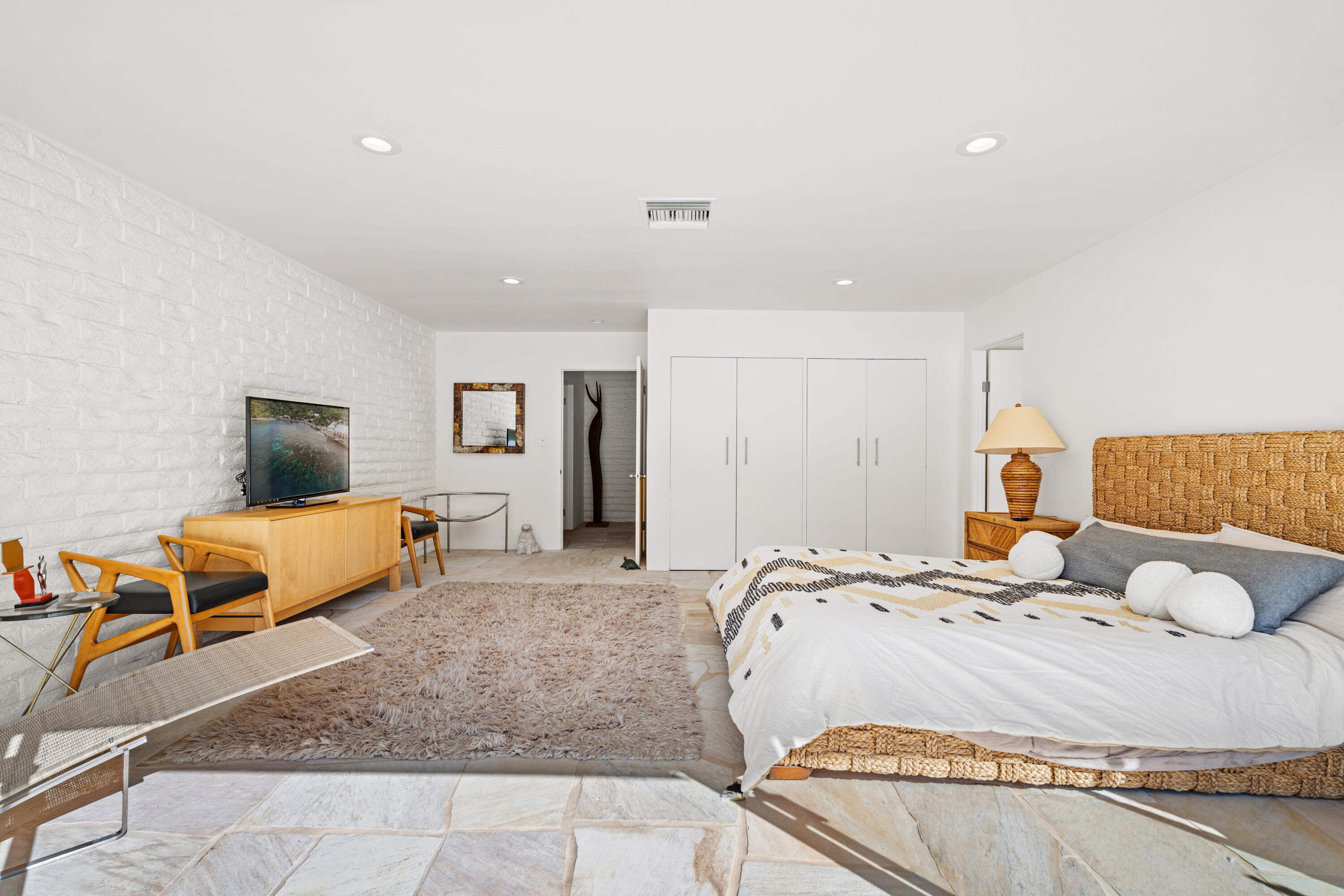 40286 Tonopah Road Rancho Mirage, CA 92270 - Photo 22 of 49 a bedroom with a bed and couch