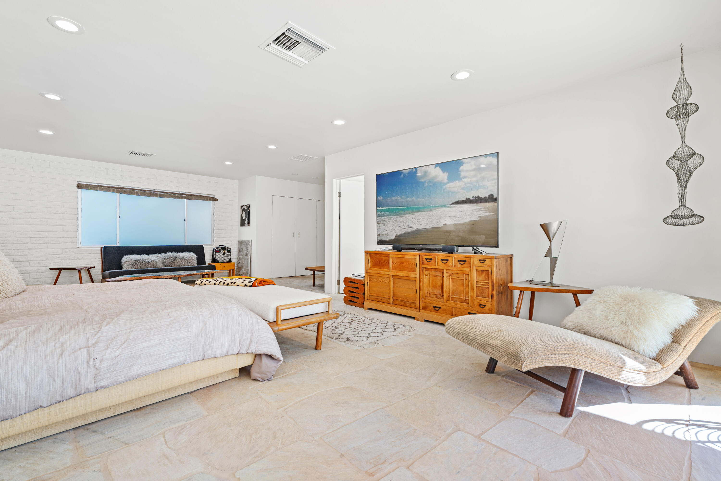 40286 Tonopah Road Rancho Mirage, CA 92270 - Photo 27 of 49 a bedroom with a bed and a flat screen tv
