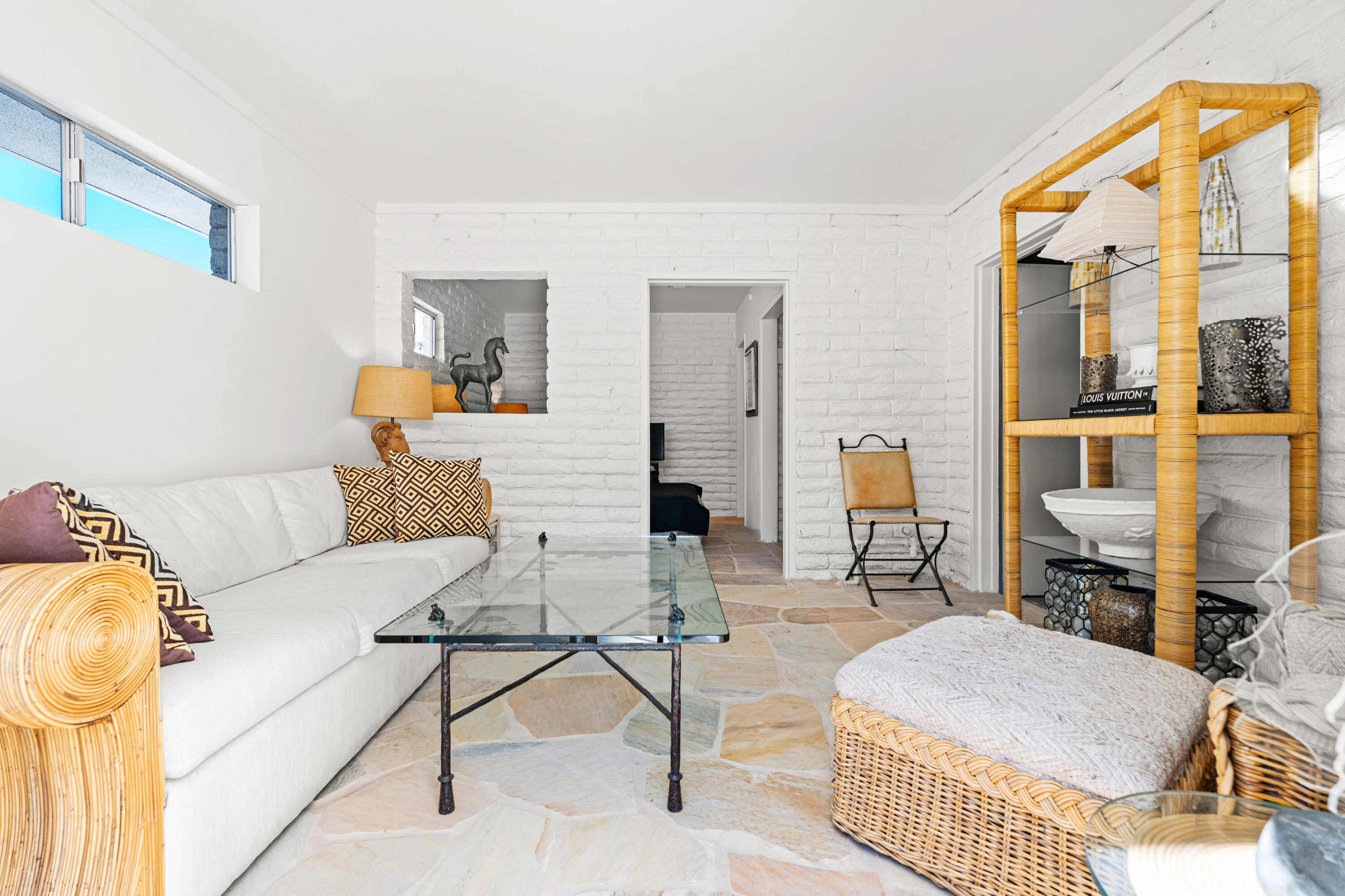 40286 Tonopah Road Rancho Mirage, CA 92270 - Photo 29 of 49 a living room with furniture and a table