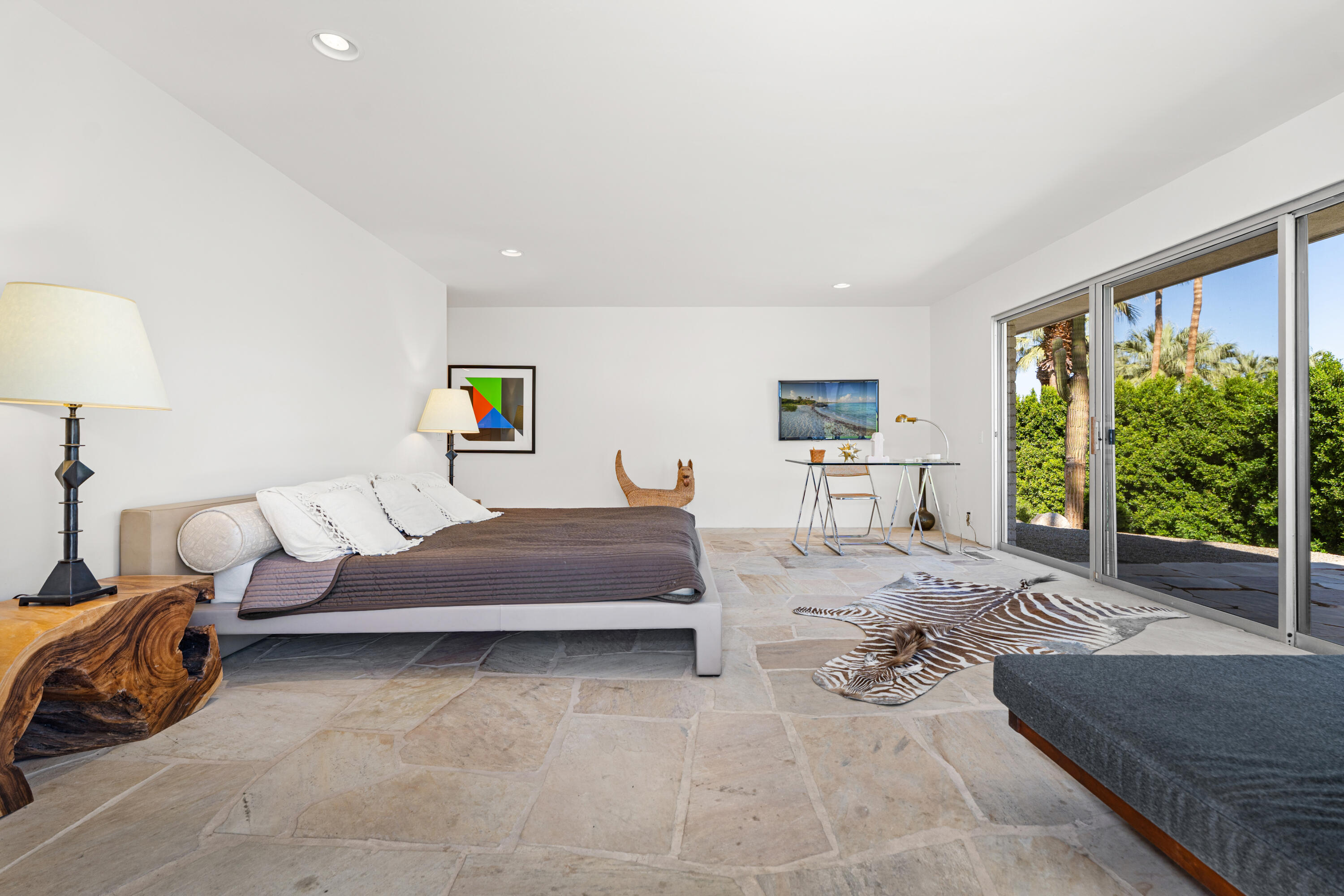 40286 Tonopah Road Rancho Mirage, CA 92270 - Photo 32 of 49 a spacious bedroom with a bed and large window