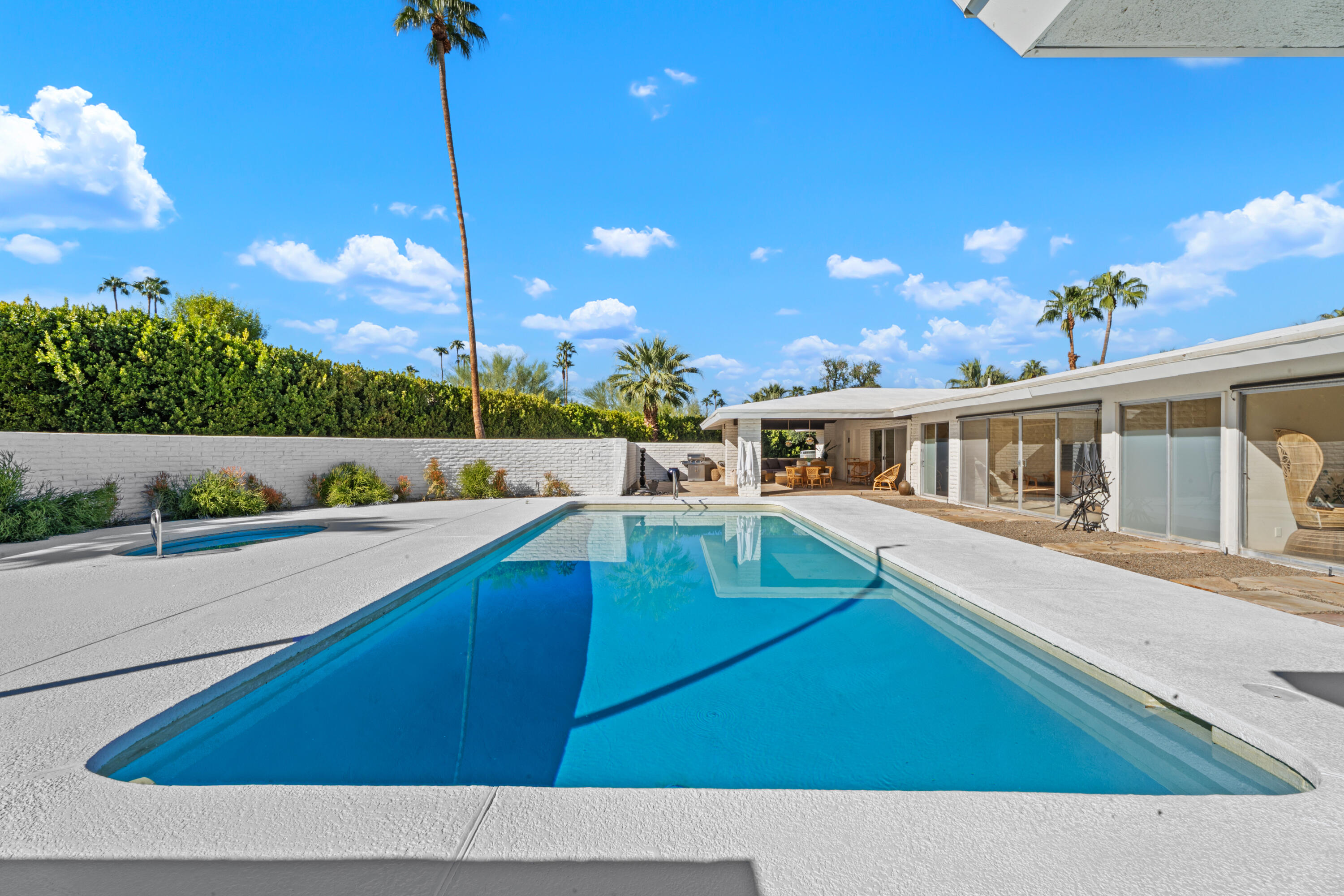 40286 Tonopah Road Rancho Mirage, CA 92270 - Photo 36 of 49 a view of a house with a swimming pool