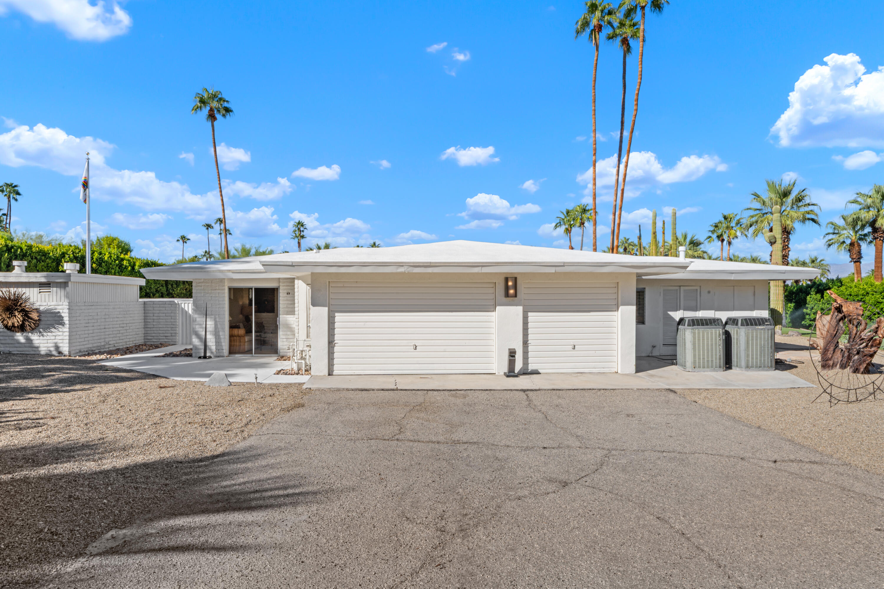 40286 Tonopah Road Rancho Mirage, CA 92270 - Photo 45 of 49 a view of a house with a patio and fire pit