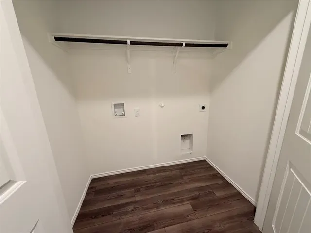 a view of a room with wooden floor and staircase