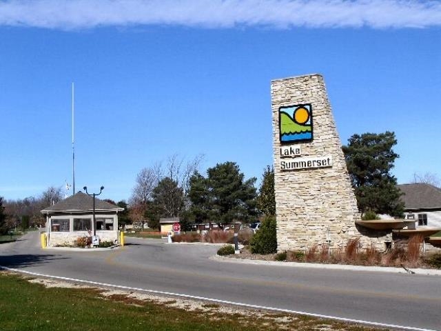 252 Lake Summerset Road Lake Summerset, IL 61019 - Photo 3 of 15 a city view with tall buildings