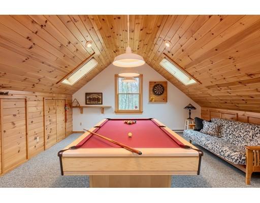 149 Beaman Road Princeton, MA 01541 - Photo 29 of 31 a living room with furniture a pool table and a fireplace