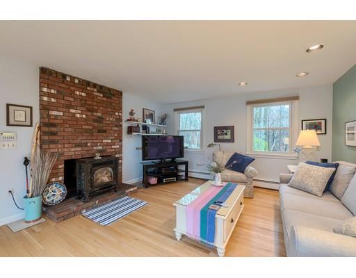 149 Beaman Road Princeton, MA 01541 - Photo 7 of 31 a living room with furniture large window and a fireplace