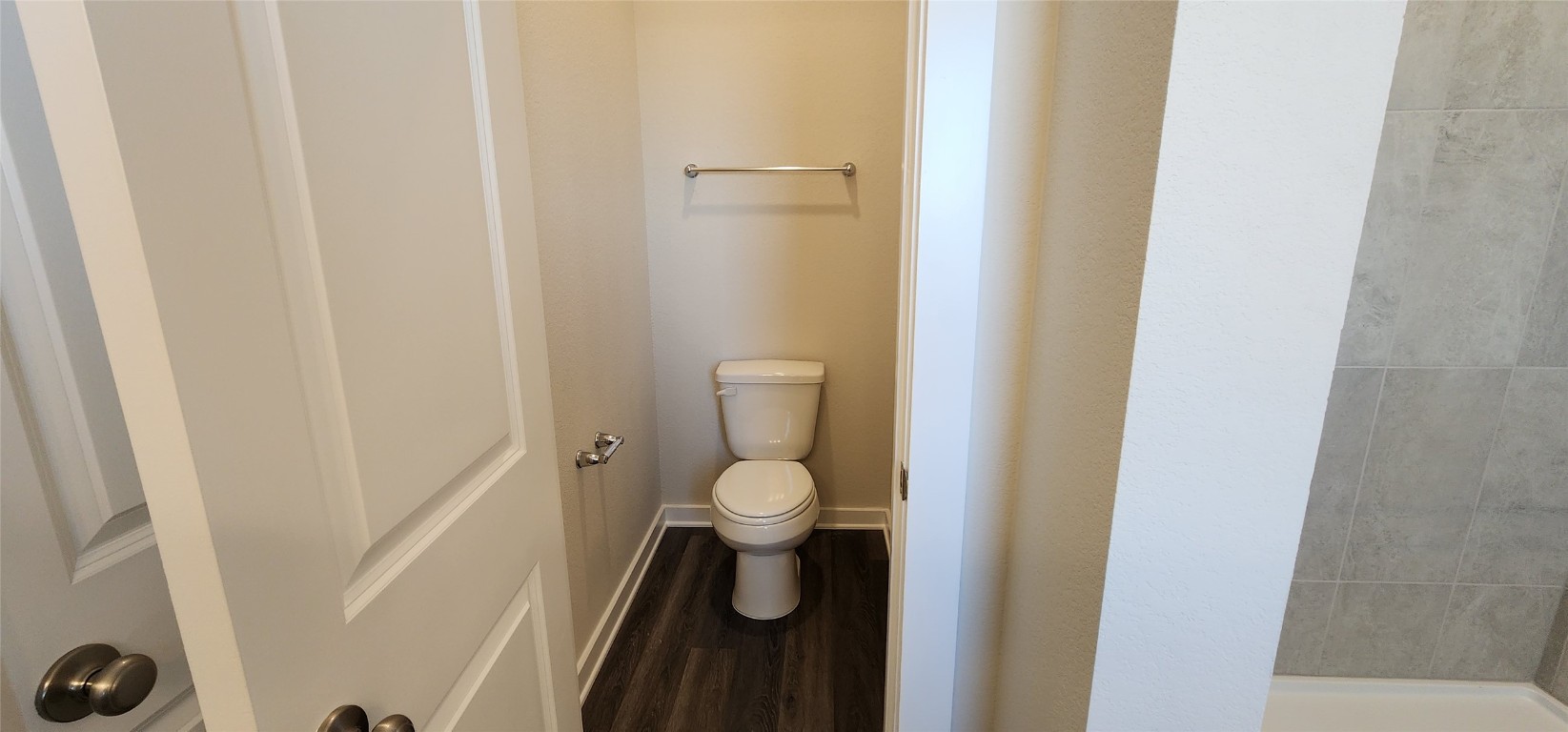 2232 Delano Drive Leander, TX 78641 - Photo 16 of 36 a bathroom with a granite countertop toilet and a shower