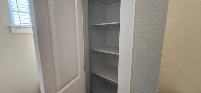 a view of an empty walk in closet
