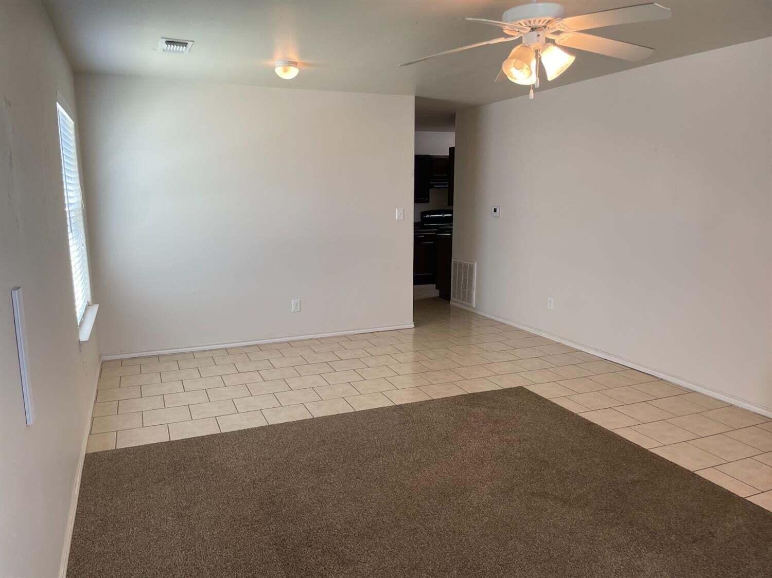 8912 Terrell Avenue Lubbock, TX 79423 - Photo 4 of 11 wooden floor in an empty room