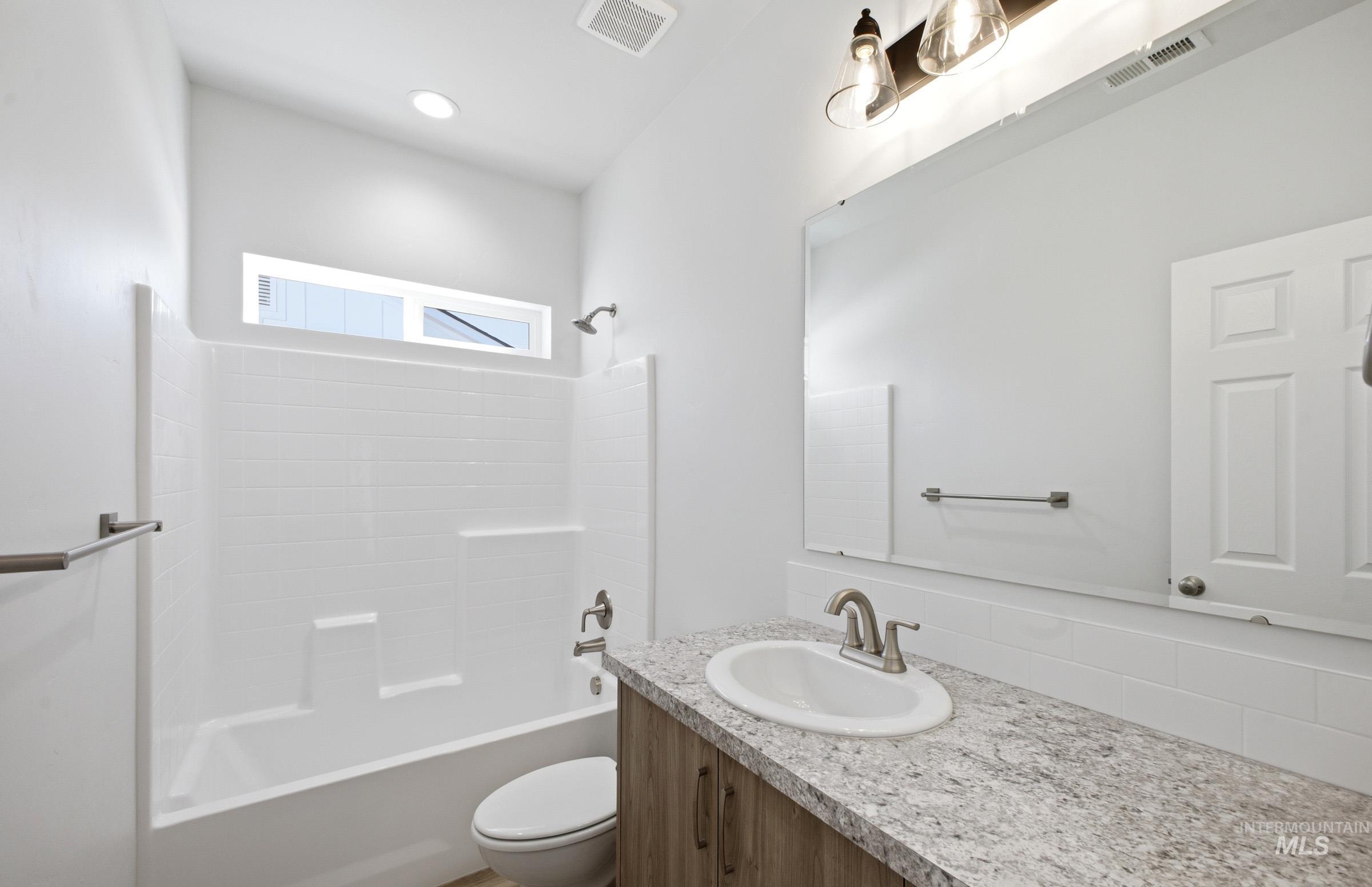 13633 Redway Court Caldwell, ID 83607 - Photo 18 of 29 Full bath with vanity and shower combination